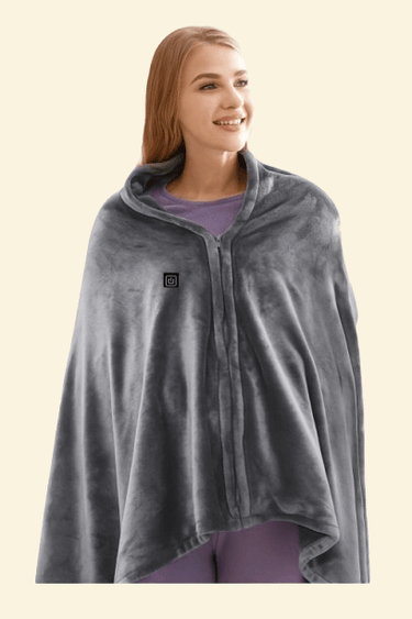 Woman wearing the Warmweave USB Heated Shawl Wrap in grey with built-in heating and soft fleece texture